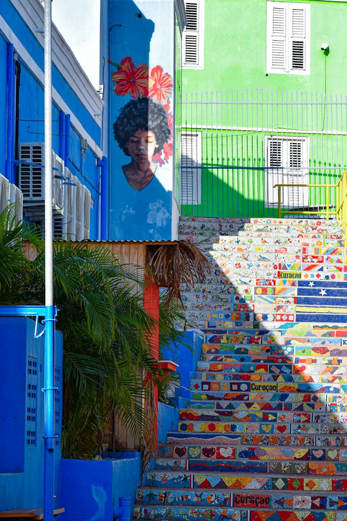 Vibrant mosaic stairs and street art in Curaçao, capturing Caribbean charm.